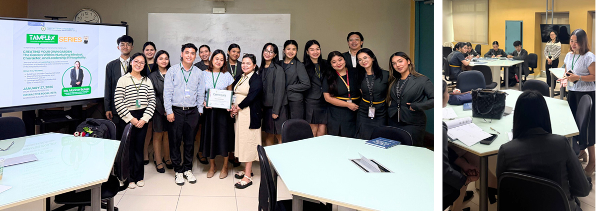 Diverse group of professionals in business attire posing for a group photo in a training room with a presentation screen.