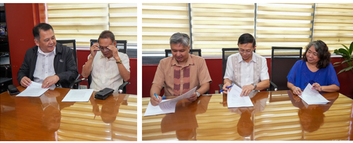 PTC joins industry-academe-government-3 | PTC Five people sit at a glossy conference table signing documents during a meeting, with blinds in the background.