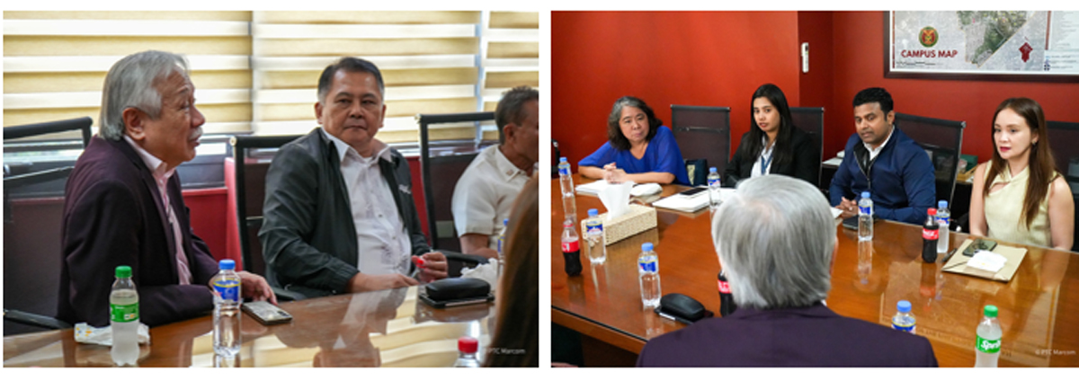 PTC joins industry-academe-government-4 | PTC Two men sit at a conference table in a meeting room, with water bottles and a phone on the table."