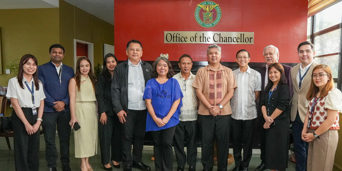 PTC joins industry-academe-government-5 | PTC Group of professionals posing for a photo in a university office, with a red wall reading 'Office of the Chancellor' behind them.