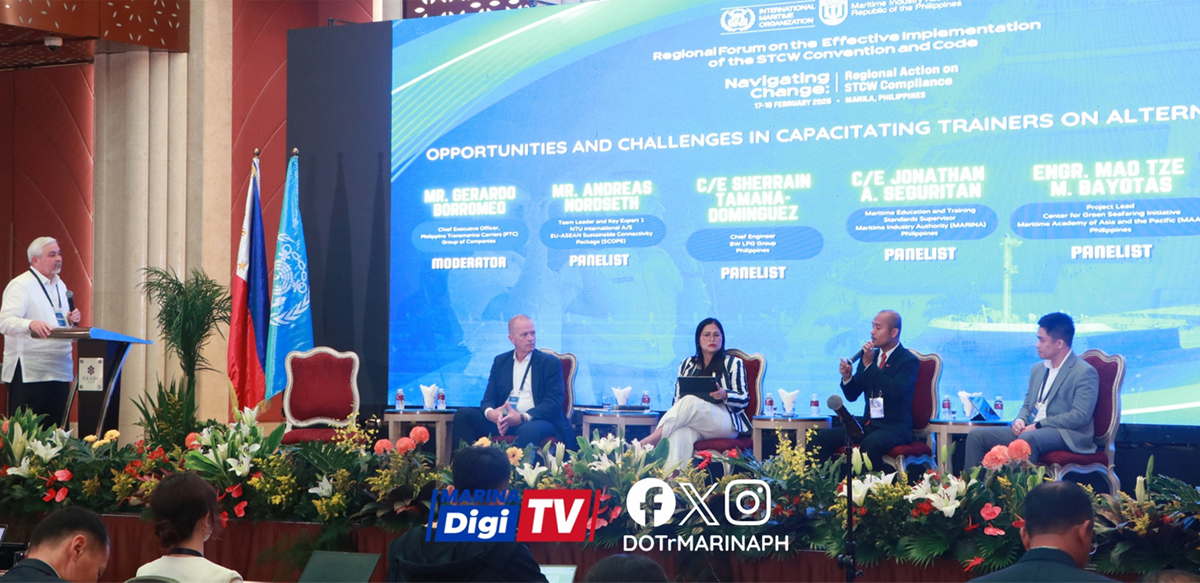 PTC participates in IMO Regional STCW | PTC Panel discussion on a stage with five panelists seated in red chairs, a speaker at a podium on the left, a large blue conference backdrop with text, and flags with flowers along the front.
