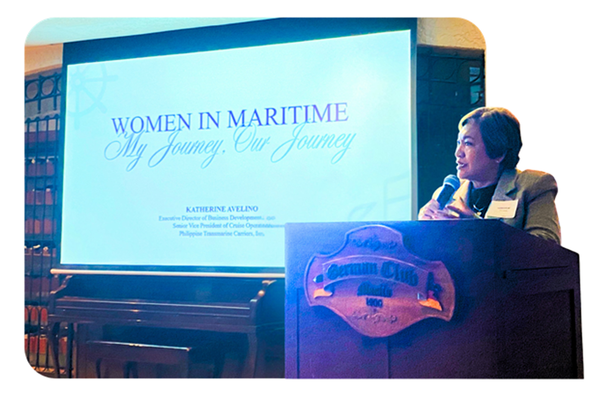 Capability Over Gender-2 | PTC Speaker at a podium giving a presentation titled 'Women in Maritime: My Journey, Our Journey' with a projector screen behind.