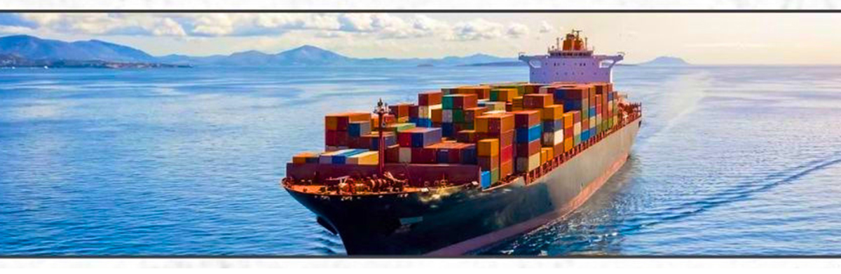 Large container ship sailing on calm blue sea with colorful stacked shipping containers on deck.