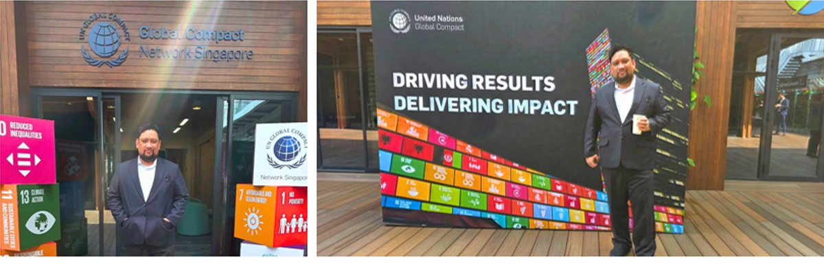 digital transformation at Singapore Maritime Week-5 | PTC Man in a dark suit stands at the Global Compact Network Singapore entrance beside a UN Global Compact display with the slogan 'Driving Results Delivering Impact'.