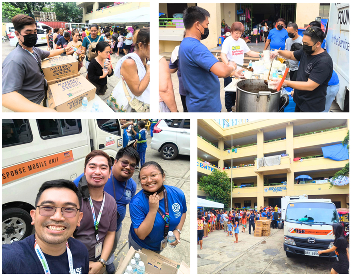 Volunteers distribute food and water to people at a relief drive outside a building.
